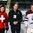GRAND FORKS, NORTH DAKOTA - APRIL 14: Switzerland's Axel Simic #19 and LatviaÕs Sandis Smons #19 receive player of the game awards from Greg Evenson, President of the NDAHA during preliminary round action at the 2016 IIHF Ice Hockey U18 World Championship. (Photo by Matt Zambonin/HHOF-IIHF Images)

